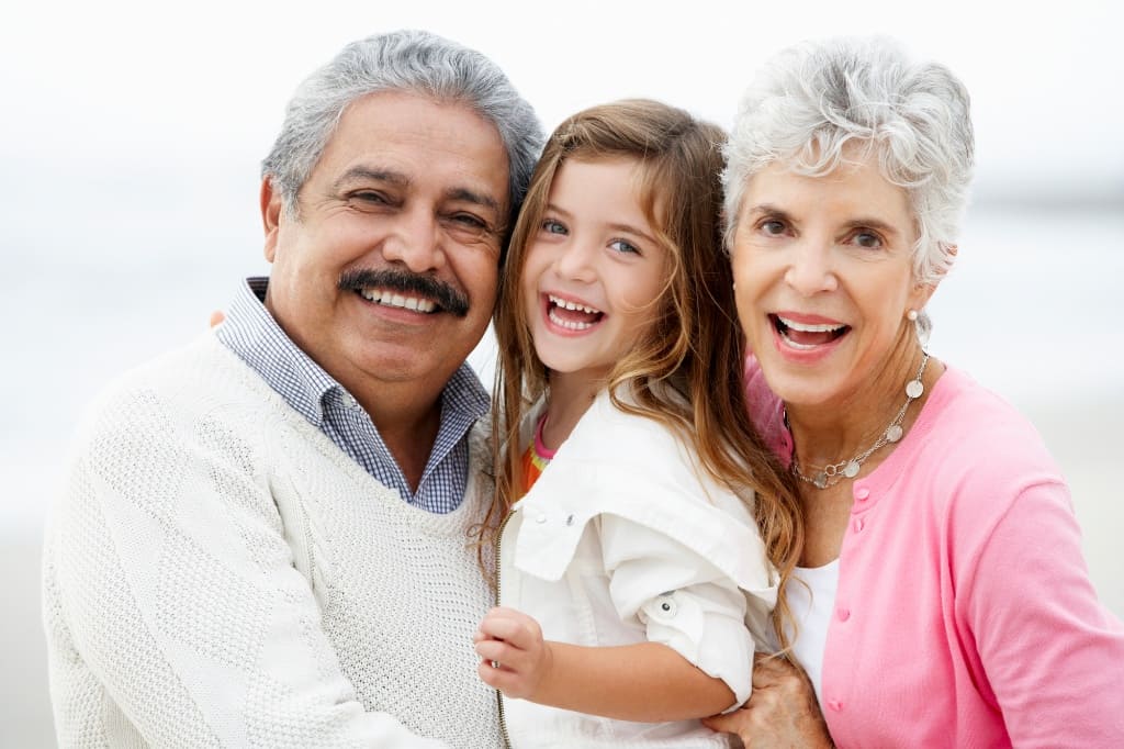 Grandparents Laughing with Their Grandchildren